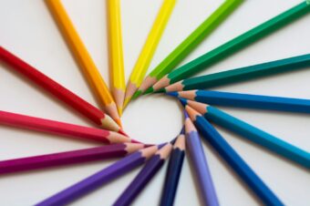 colored pencils arranged in a spiral with the tips forming a circle